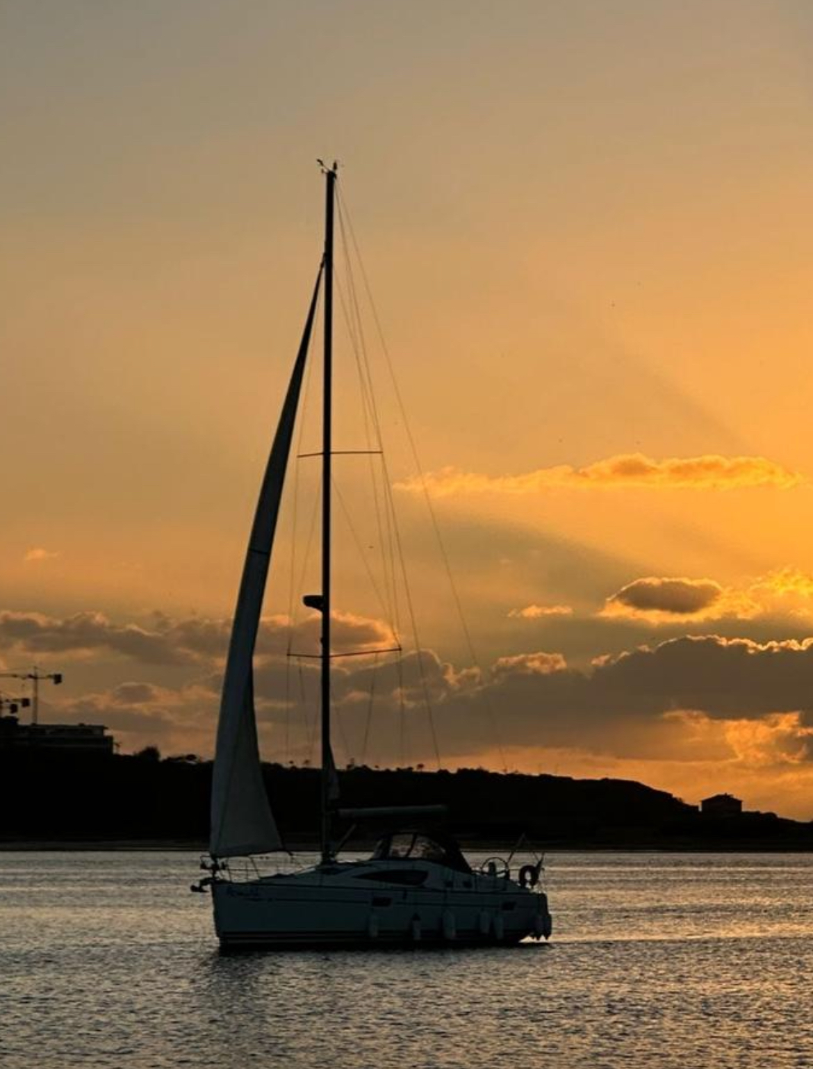 Couple watching the sunset on board